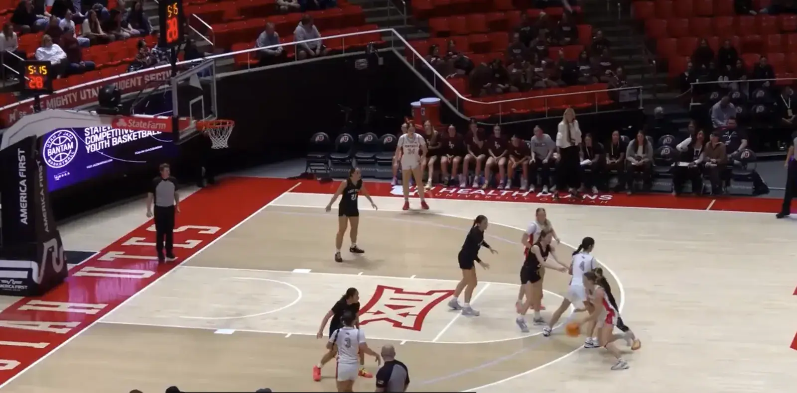 State playoff broadcast frame — Kaylee bringing the ball up at the Huntsman Center